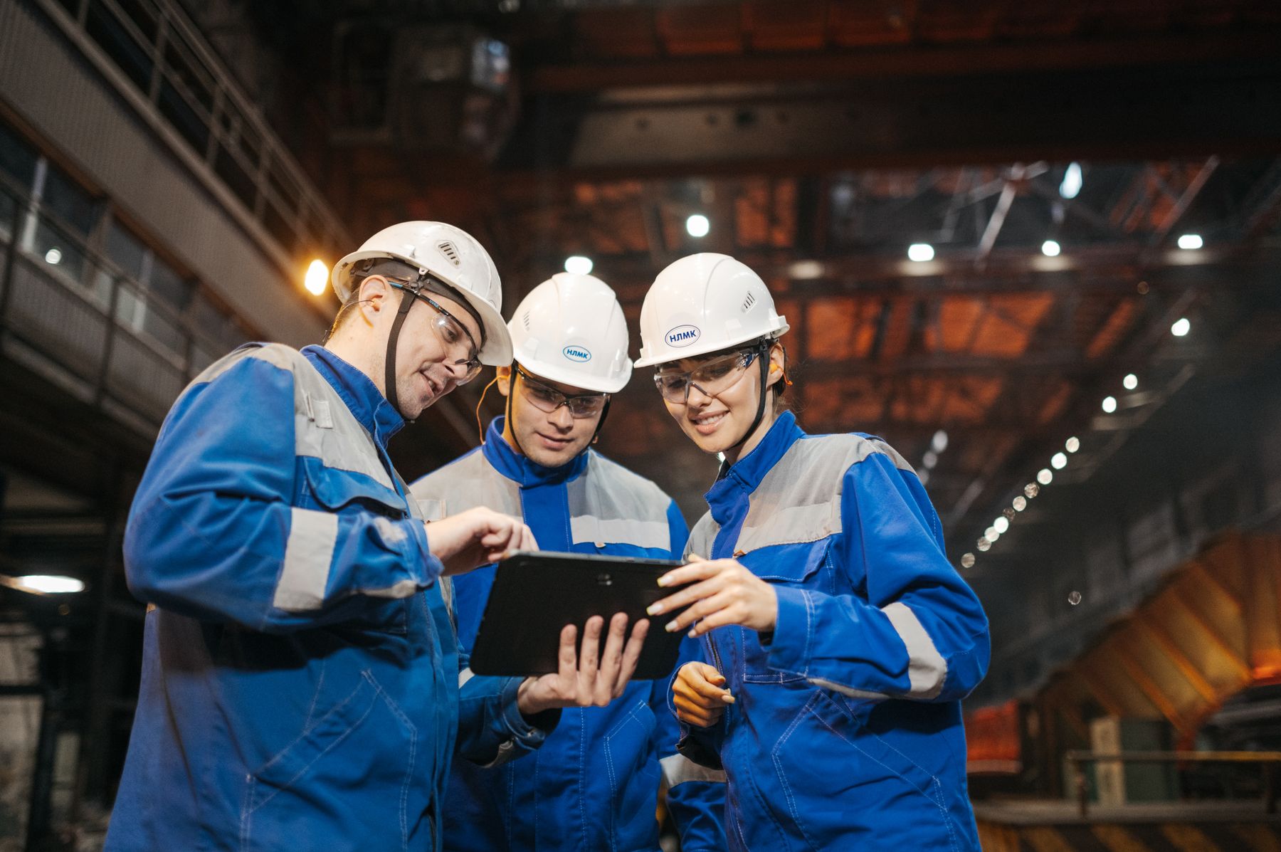 Engineering team reviewing technical information in an industrial facility